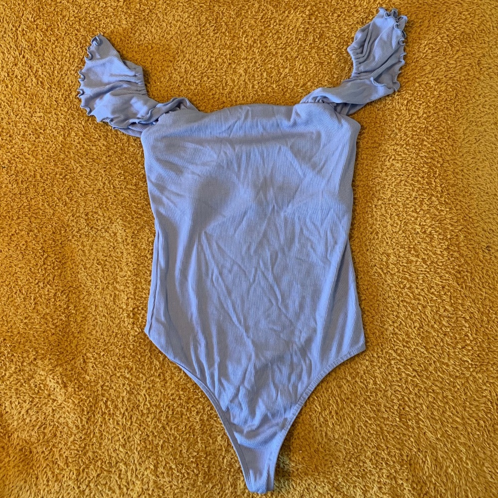 lilac body suit with ruffle sleeves